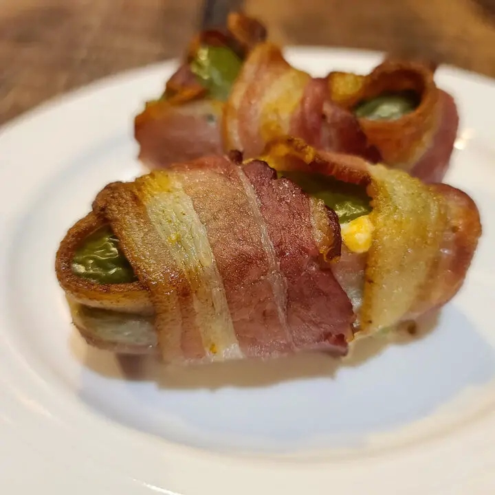 Double Bacon Wrapped Jalapeno Poppers on a white plate
