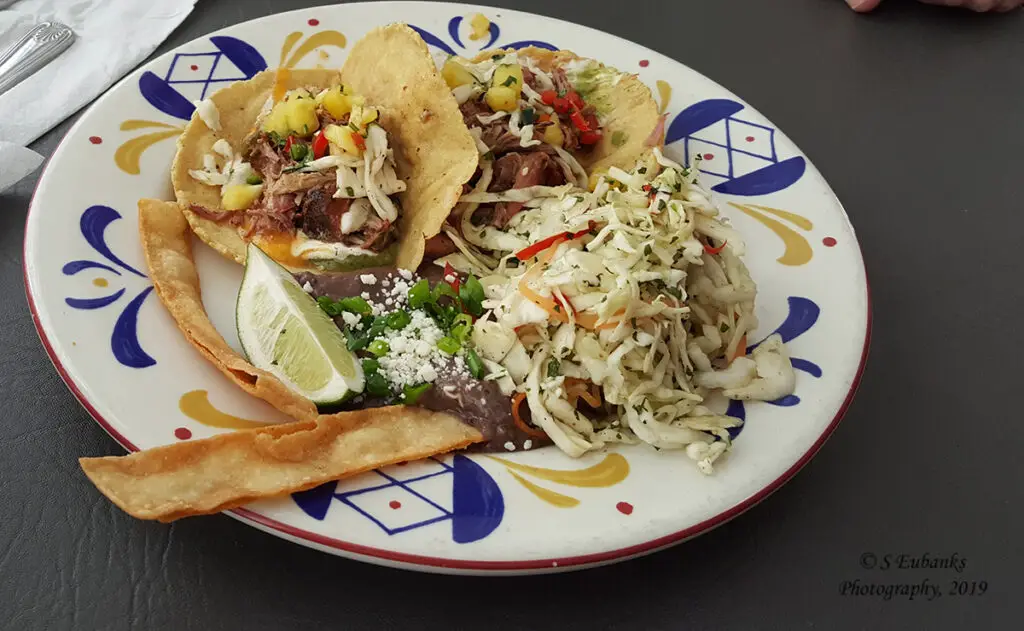 Pork Tacos with Pineapple Slaw on a colorful plate at The Shack in Covington, LA