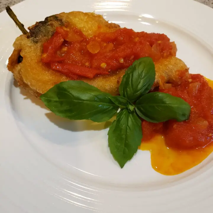 Cheese Chile Relleno on a white plate