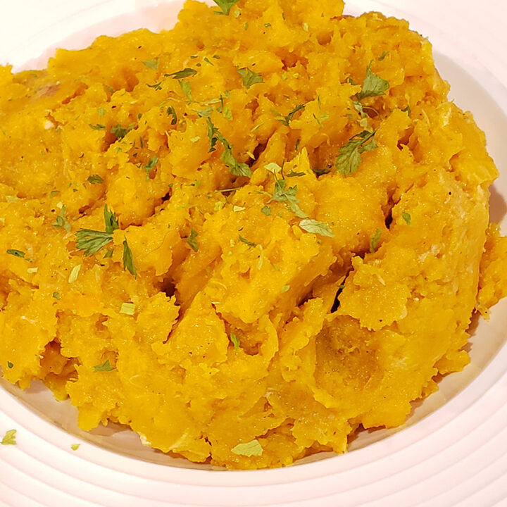 Roasted Garlic and Butternut Squash Mash in a white bowl