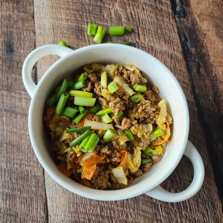 Instant Pot Eggroll in a Bowl Recipe in a white bowl on a rustic board table