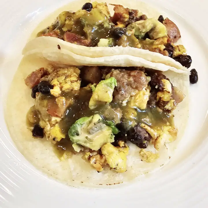Two Breakfast Tacos on a white plate